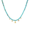 Turquoise necklace with gold charms